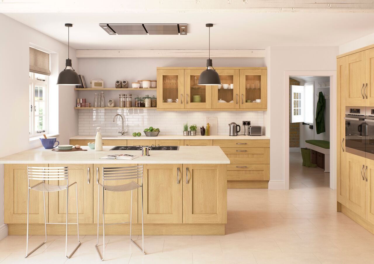 A light oak shaker kitchen with a central island and solid timber worktops