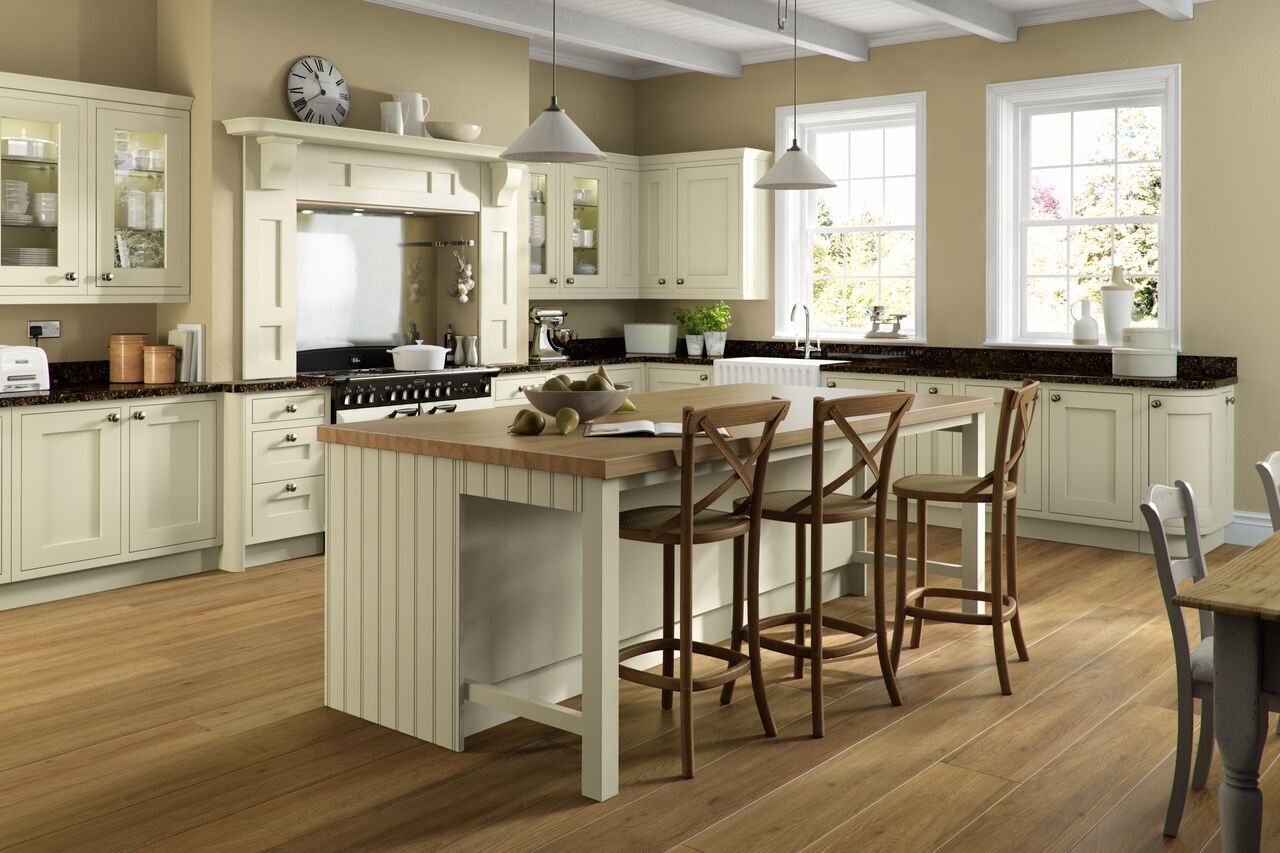 A cream in-frame kitchen with a large timber island, made in the DCL workshop